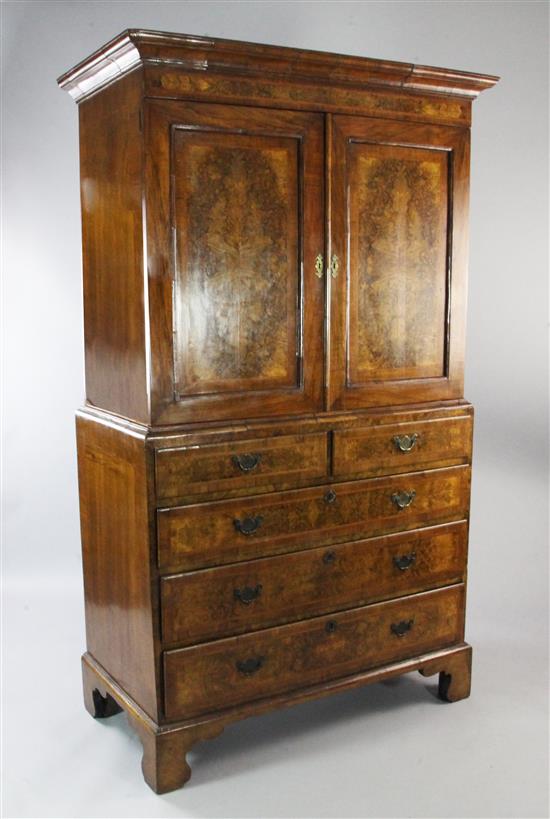 A mid 18th century walnut and featherbanded linen press, W.3ft 8.5in.